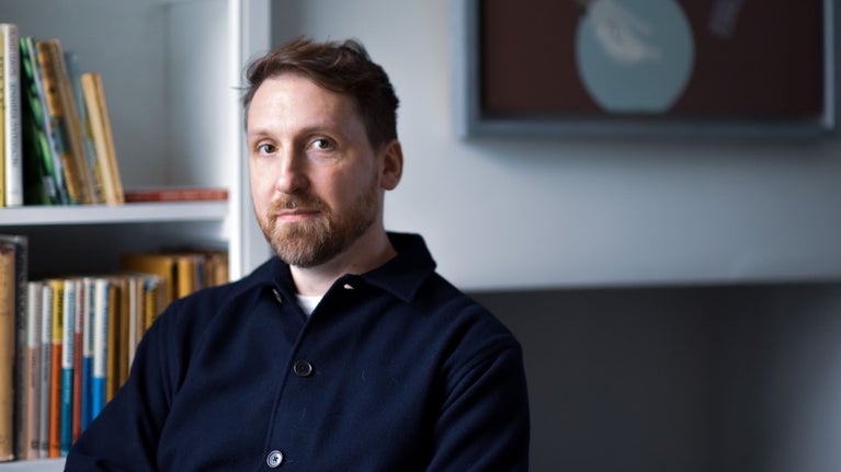 A headshot of artist Ed Kluz.